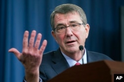 FILE - Defense Secretary Ash Carter at a news conference at the Pentagon, Jan. 28, 2016. The Pentagon announced a pilot program seeking properly vetted hackers to attack its public web pages.