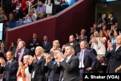 Delgates at the Republican National Convention cheer as Fran Tarkenton speaks, in Cleveland, July 21, 2016.