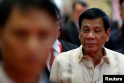 FILE - Philippines’ President Rodrigo Duterte arrives at the East Asia Summit in Vientiane, Laos, Sept. 8, 2016.