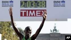 Patrick Makau from Kenya crosses the finish line to win the 38th Berlin Marathon in Berlin, Germany, in a new world record time of 2 hours, 3 minutes, 38 seconds, September 25, 2011.