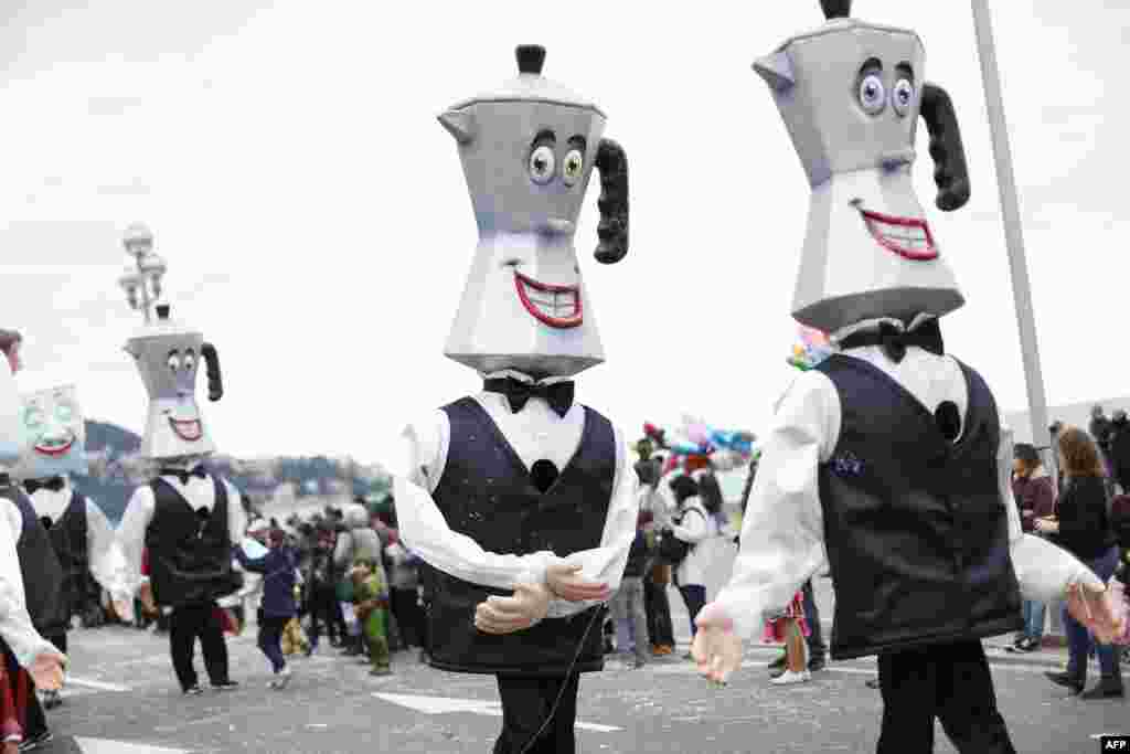 Dancers parade during the Nice Carnival in Nice, southeastern France. The theme of this year&#39;s carnival, running from Feb. 14 until March 4, 2014, is the &quot;King of Gastronomy&quot;. 