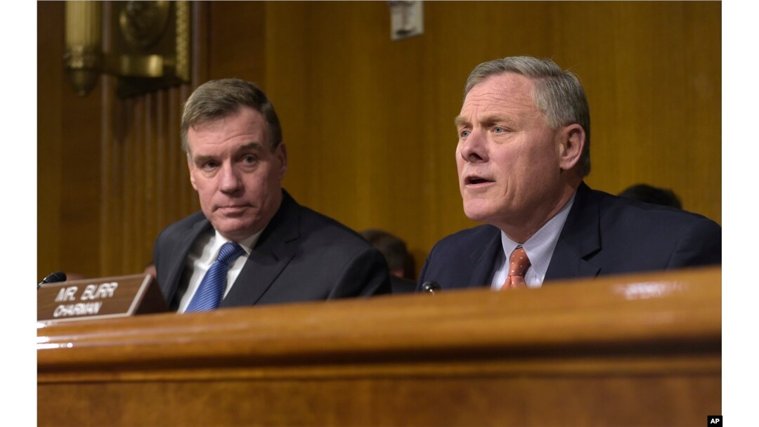 FILE - Senate Intelligence Committee Chairman. Sen. Richard Burr, R-N.C., right, joined by Vice Chairman Sen. Mark Warner, D-Va., left, speaks at the Senate Intelligence Committee hearing on Capitol Hill in Washington, March 30, 2017.
