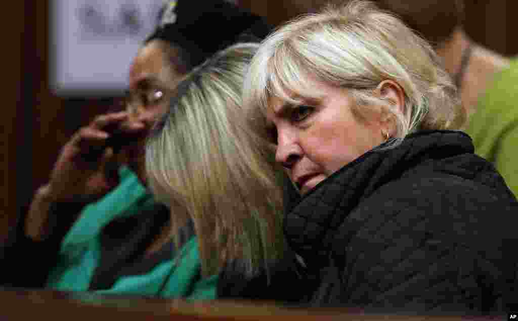 June Steenkamp bows her head while listening to forensic evidence in Pretoria, April 17, 2014. 