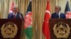 Turkish Prime Minister Binali Yildirim, left, and Afghanistan's Chief Executive Abdullah Abdullah, speak during a press conference in Kabul, Afghanistan, April 8, 2018.