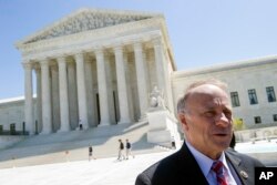 Rep. Steve King, R-Iowa speaks with reporters in front of the Supreme Court in Washington.