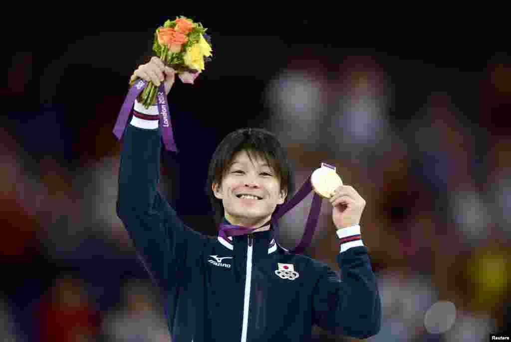 Kohei Uchimura of Japan celebrates winning a gold medal during the men's individual all-around gymnastics final in the North Greenwich Arena during the London 2012 Olympic Games August 1, 2012.