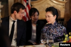 China's first lady Peng Liyuan talks with Trump Senior Adviser Jared Kushner as they attend a dinner at the start of a summit between U.S. President Donald Trump and Chinese President Xi Jinping at Trump's Mar-a-Lago estate in West Palm Beach, Florida, Ap