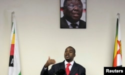 FILE: Zimbabwe's main opposition party the Movement For Democratic Change's Nelson Chamisa gestures as he addresses a news conference at party headquarters in Harare,Oct. 27, 2009.