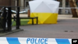 FILE - A police tent covers the spot where former Russian double agent Sergei Skripal and his daughter Yulia were found critically ill, in Salisbury, Britain, March 6, 2018.