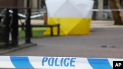 A police tent covers the spot in Salisbury, Britain, March 6, 2018, where former Russian double agent Sergei Skripal and his daughter Yulia were found critically ill Sunday following a suspected exposure to an "unknown substance."