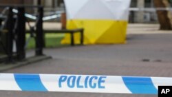 A police tent covers the spot in Salisbury, Britain, March 6, 2018, where former Russian double agent Sergei Skripal and his daughter Yulia were found critically ill Sunday following a suspected exposure to an "unknown substance."