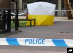 A police tent covers the spot in Salisbury, Britain, March 6, 2018, where former Russian double agent Sergei Skripal and his daughter Yulia were found critically ill Sunday following a suspected exposure to an "unknown substance," later determined to have been a nerve agent.