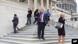 Members of Congress depart the Capitol in Washington, after last votes Friday, Sept. 25, 2015. 