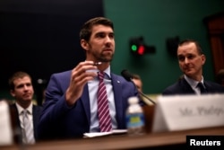 FILE - Olympic gold medalist Michael Phelps testifies before the House Oversight and Investigations Subcommittee about anti-doping policy in international sport in Washington, Feb. 28, 2017.