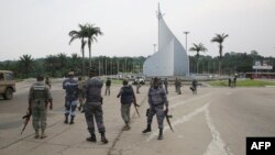 Gabonese gendarmes patrol on the Democracy square in Libreville, Jan. 7, 2018, after a group of soldiers sought to take power while the country's ailing president was abroad.