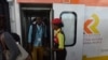 FILE - Passengers disembark upon arrival in a Mombasa-to-Nairobi train launched to operate on the Standard Gauge Railway (SGR), May 31, 2017. New details about a contract signed in 2014 reveal what’s at stake if Kenya defaults on its loan to the Export-Import Bank of China.