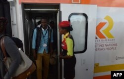FILE - Passengers disembark upon arrival in a Mombasa-to-Nairobi train launched to operate on the Standard Gauge Railway, May 31, 2017.