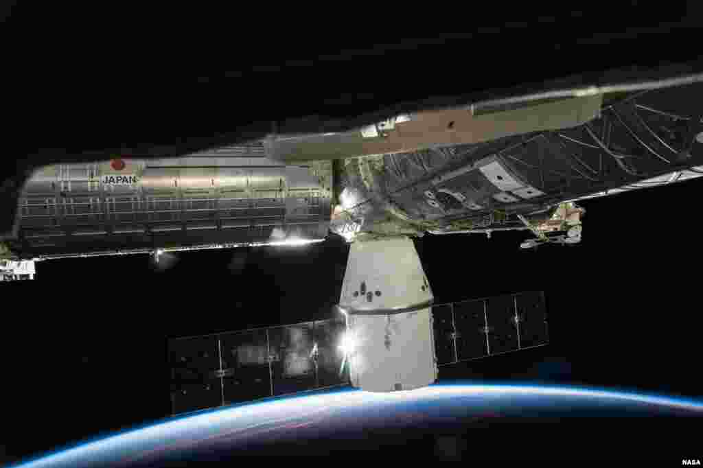 SpaceX’s Dragon cargo capsule is seen docked to the Earth facing port of the International Space Stations's Harmony module. SpaceX’s sixth commercial resupply flight to the ISS launched on April 14 and arrived three days later. It will depart with over 3,100 pounds of research samples and equipment and splashdown in the Pacific Ocean on May 21.