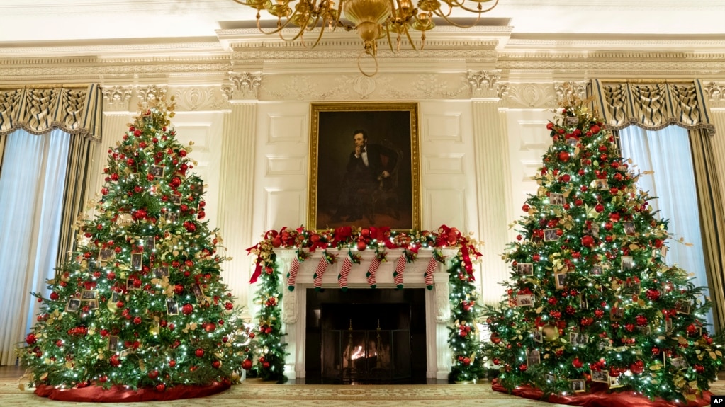 The State Dining Room of the White House is decorated for the holiday season during a press preview of the White House holiday decorations, on Monday, Nov. 29, 2021, in Washington. (AP Photo/Evan Vucci)