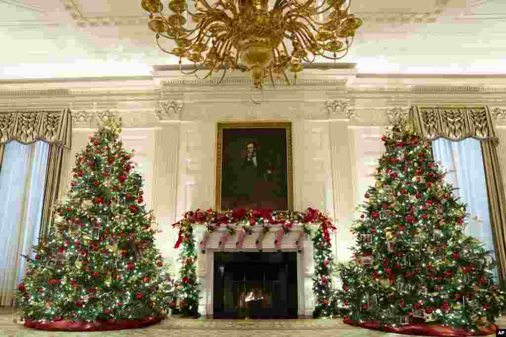 The State Dining Room of the White House is decorated for the holiday season during a press event for the White House holiday decorations, on Monday, Nov. 29, 2021, in Washington. (AP Photo/Evan Vucci)