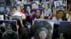 Students hold portraits of deceased former South Korean "comfort women" during a weekly anti-Japan rally in front of the Japanese Embassy in Seoul, South Korea, Dec. 30, 2015. 