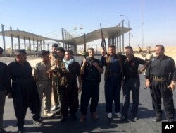 Kurdish security forces and volunteers deploy in the southern entrance of the oil-rich city of Kirkuk, 290 kilometers (180 miles) north of Baghdad, Iraq, Oct. 16, 2017.