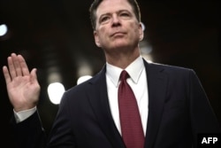 U.S. -- Former FBI Director James Comey takes the oath before he testifies during a US Senate Select Committee on Intelligence hearing on Capitol Hill in Washington,DC, June 8, 2017.