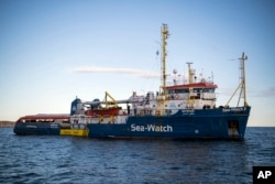 The Sea-Watch rescue ship waits off the coast of Malta, Jan. 8, 2018. Two German nonprofit groups are appealing to European Union countries to take in 49 migrants whose health is deteriorating while they are stuck on rescue ships in the Mediterranean Sea.