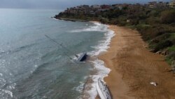 Sailboats used by smugglers to transport migrants and refugees are beached on Le Cannelle beach in Isola Capo Rizzuto, Calabria region, Italy, Nov. 13, 2021. Thousands of refugees have arrived in Italy this fall by a lesser-known migrant route, the Calabrian route from Turkey, paying heftier smuggling fees to travel on recreational sailboats that can be less conspicuous than the crammed inflatable boats used in the Central Mediterranean.