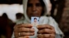 Kareeman Bano holds a photograph of her son-in-law Rakbar Khan, who was killed by a mob on suspicion of cattle smuggling, in Kolgaon village, India, July 24, 2018. Mob attacks on minority groups have occurred since the Hindu nationalist BJP swept elections in 2014.