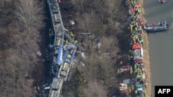 Aerial view shows firefighters and emergency doctors working at the site of a train accident near Bad Aibling, southern Germany,Feb. 9, 2016.