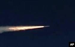 FILE - Photo made from footage taken from Russian Defense Ministry official web site on March 11, 2018 shows the Kinzhal hypersonic missile flying during a test in southern Russia.