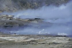 This August 2019 photo released by the National Oceanic and Atmospheric Administration Fisheries (NOAA) shows steam from volcanic vents rising on Bogoslof Island, Alaska.