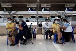 People get vaccinated against COVID-19 at Suvarnabhumi in Bangkok on April 28, 2021.