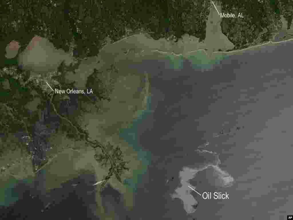 NASA's Aqua satellite captured this image of the Gulf of Mexico, 25 Apr 2010. With the Mississippi Delta on the left, the silvery swirling oil slick from explosion. (NASA Image)