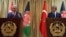 Turkish Prime Minister Binali Yildirim, left, and Afghanistan's Chief Executive Abdullah Abdullah, speak during a press conference in Kabul, Afghanistan, April 8, 2018.