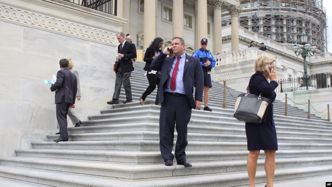 Members of Congress depart the Capitol in Washington, after last votes Friday, Sept. 25, 2015. 