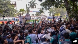 Policemen try to stop Bangladesh Nationalist Party activists marching near prime minister Sheikh Hassan's Awami League party office in Dhaka, Bangladesh, Nov. 10, 2024.