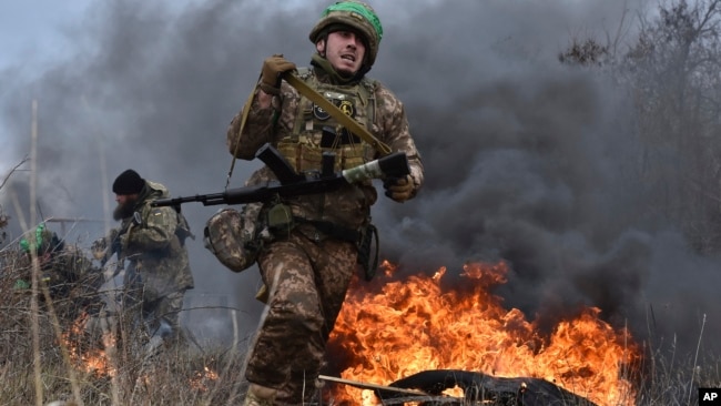 In this photo provided by Ukraine's 65th Mechanised Brigade press service on Jan. 8, 2025, a Ukrainian serviceman trains at the polygon in the Zaporizhzhia region, Ukraine.