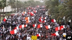Thousands of anti-government protesters march to the Saudi embassy in Manama, March 15, 2011