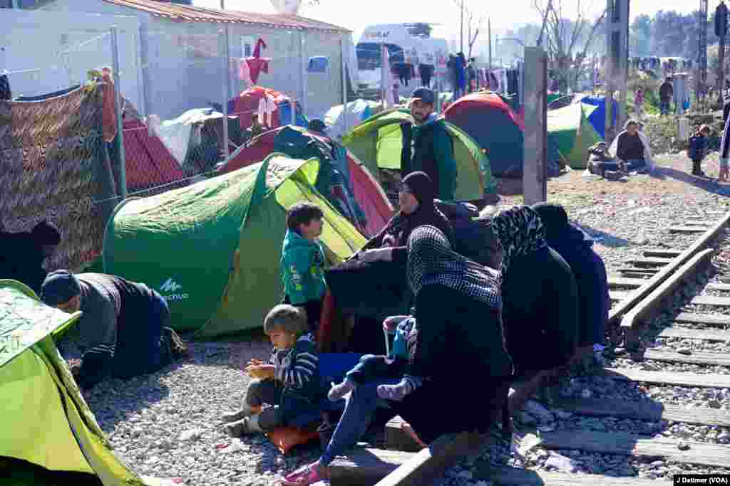 On the Tracks: a Syrian family wait to see if the border will be re-opened. Many who spent more than 30-days in Turkey before trying to make ini to Europe worry they will be turned back.