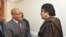 South Africa's President Jacob Zuma greets Libyan leader Moammar Gadhafi before their meeting in Tripoli