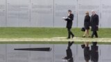 Messina Weiss (L) the granddaughter of a Holocaust survivor and German President Joachim Gauck (R) and his partner Daniela Schadt attend the inauguration of the memorial in Berlin, Germany, October 24, 2012.