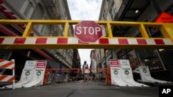 Newly installed security barriers are seen on Bourbon Street next to a memorial for victims of a Jan. 1 car attack, ahead of the Super Bowl in New Orleans, Louisiana, Jan. 31, 2025. 