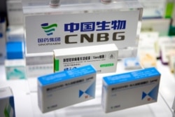 FILE - A box for a COVID-19 vaccine is displayed at an exhibit by Chinese pharmaceutical firm Sinopharm at the China International Fair for Trade in Services in Beijing, China, Sept. 5, 2020.