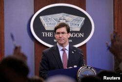 FILE - U.S. Defense Secretary Mark Esper speaks during a press briefing at Pentagon in Arlington, Virginia, Dec. 20, 2019.