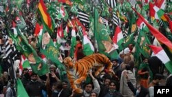 Supporters of Pakistan Democratic Movement gather during an anti-government rally in Lahore on Dec. 13, 2020. 
