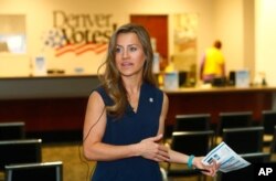FILE - Amber McReynolds, director of elections for the City and County of Denver, talks during a media tour in Denver, Oct. 28, 2016.