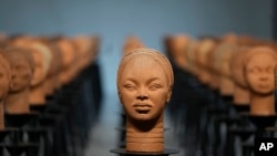 FILE - Sculptures created by French artist Prune Nourry, represent the remaining 108 Chibok still in captivity are displayed in Lagos, Nigeria, December 13, 2022. 