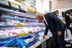 US Ambassador to Japan Rahm Emanuel visits Hamanoeki Fish Market and Food Court, as part of his trip to Soma City in Fukushima Prefecture on August 31, 2023. (Photo by Philip FONG / AFP)